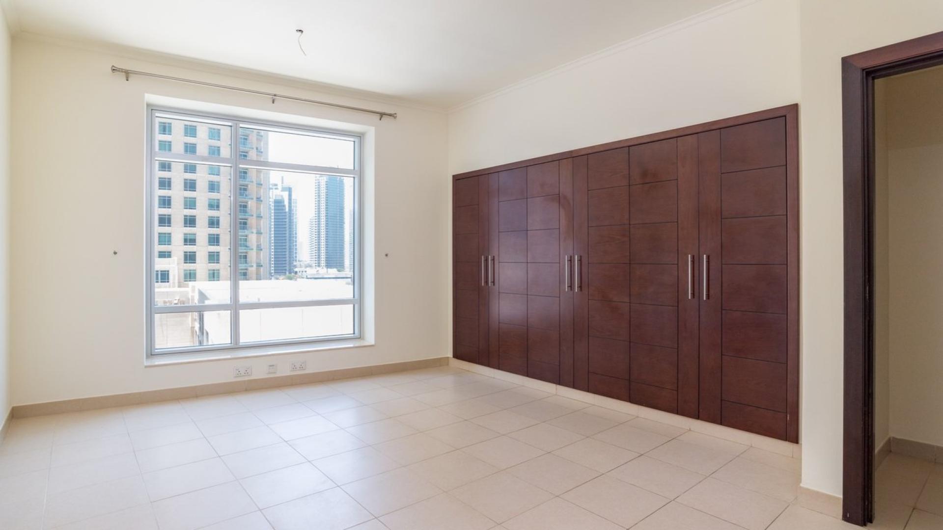 Spacious Downtown Dubai apartment interior with stunning Burj Khalifa views through large windows