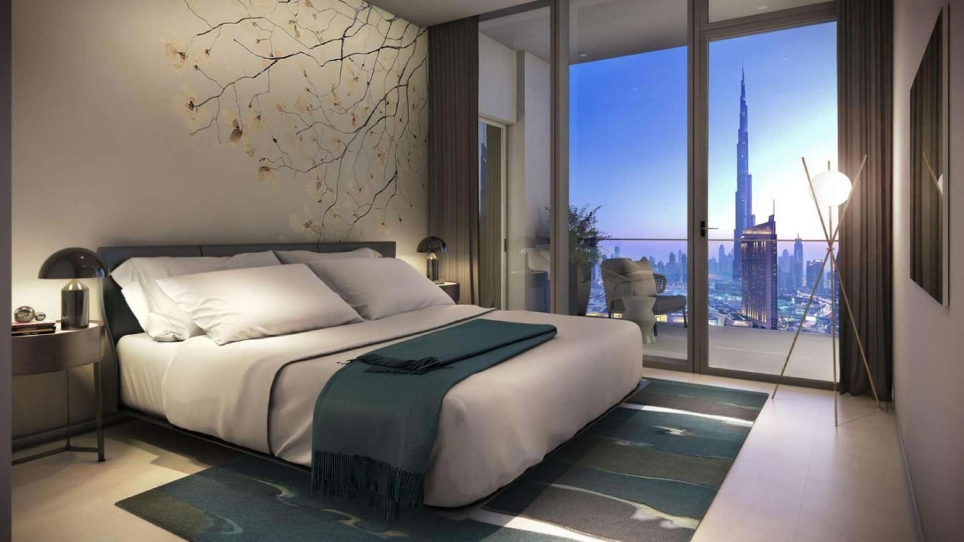 Modern kitchen in high-floor Downtown Dubai apartment with balcony and city view
