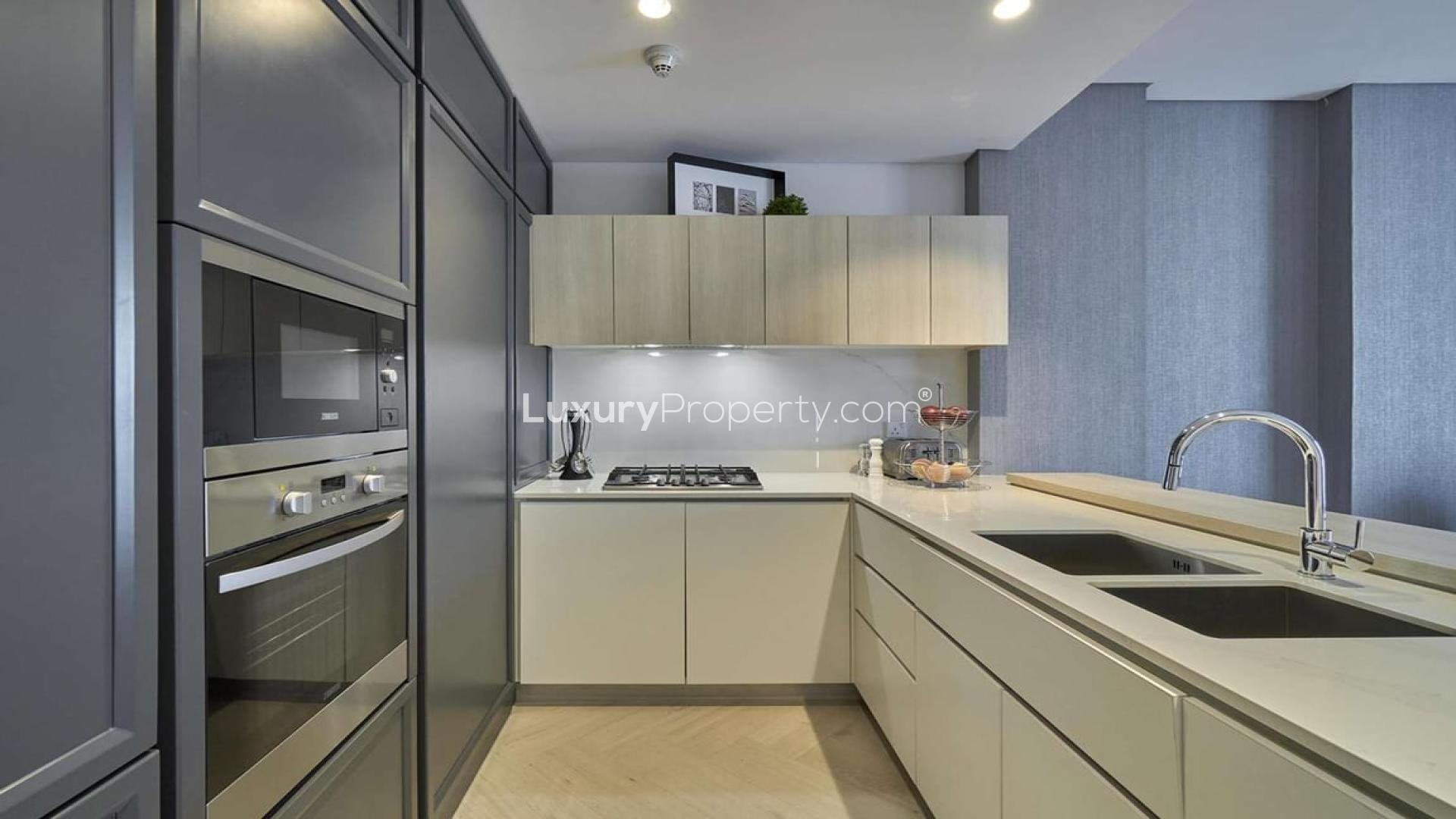 Modern kitchen in Wilton Terraces 1 apartment, Mohammed Bin Rashid City, featuring sleek cabinetry