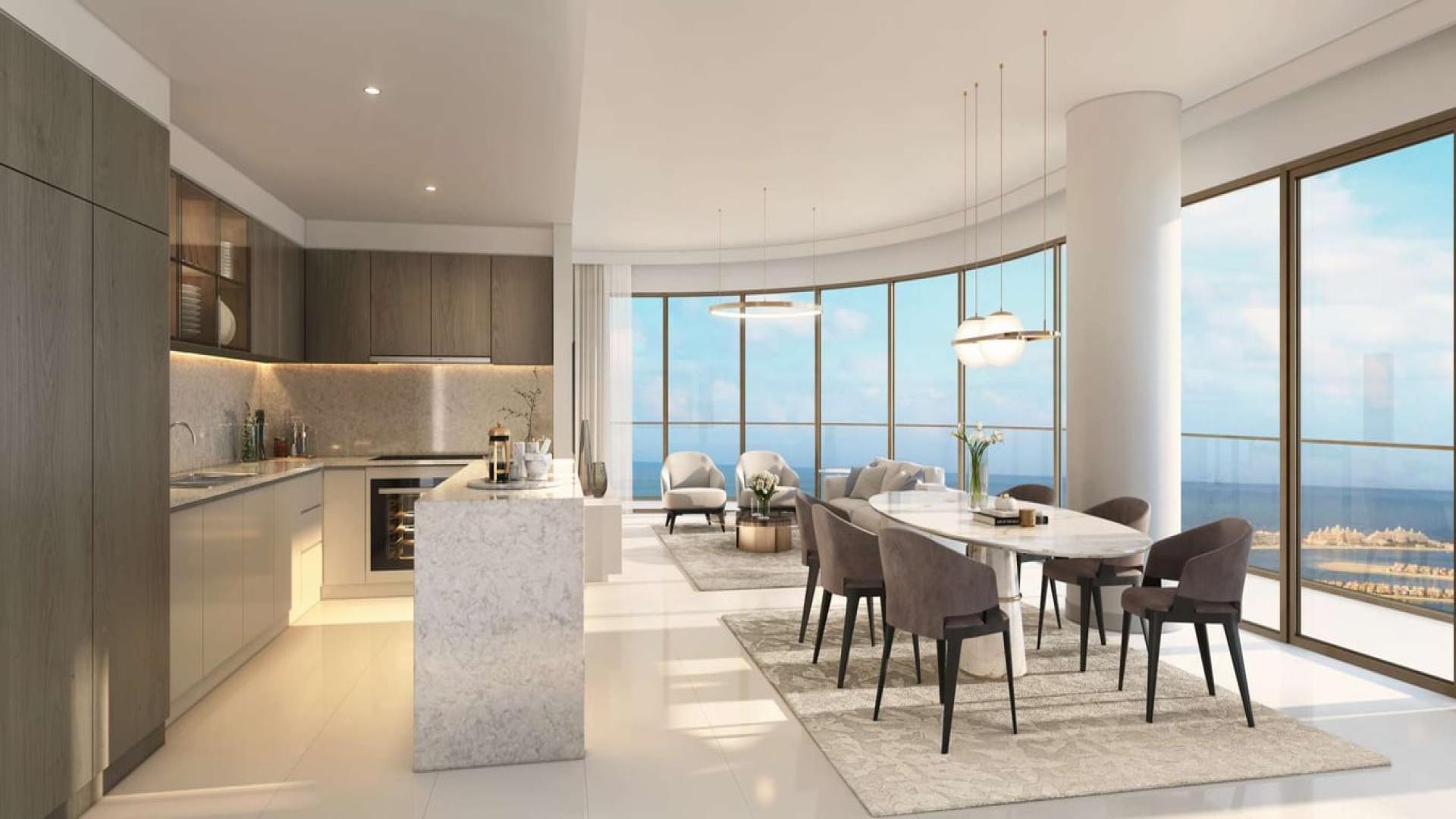 Luxury beachfront apartment kitchen and dining area with ocean view, designed by Elie Saab