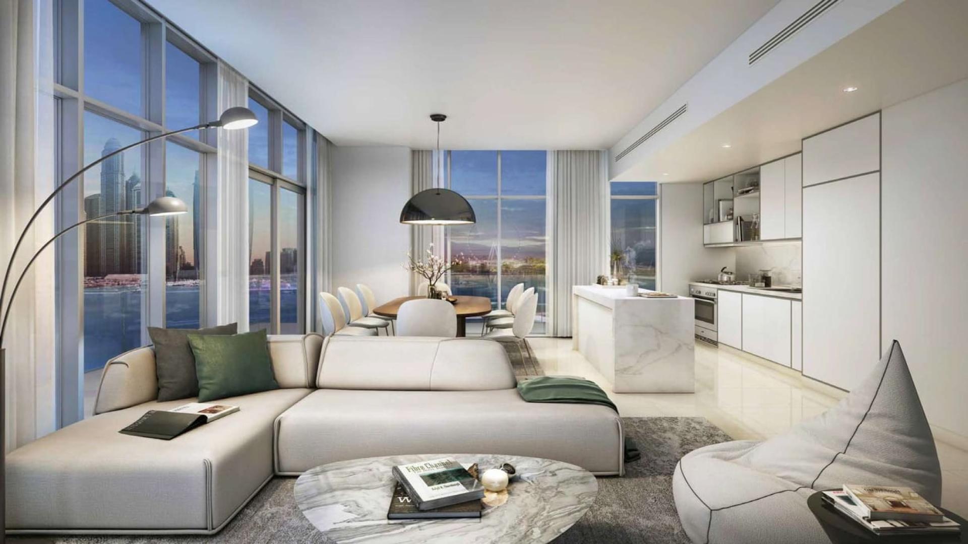 Infinity pool with city skyline view at Emaar Beachfront, Dubai Harbour apartment for sale