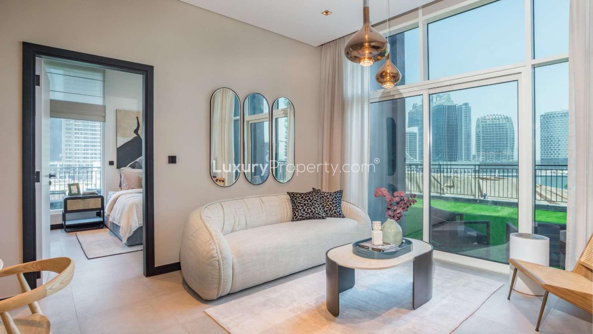 Modern living room with Dubai Canal view in Business Bay apartment for sale, 15 Northside