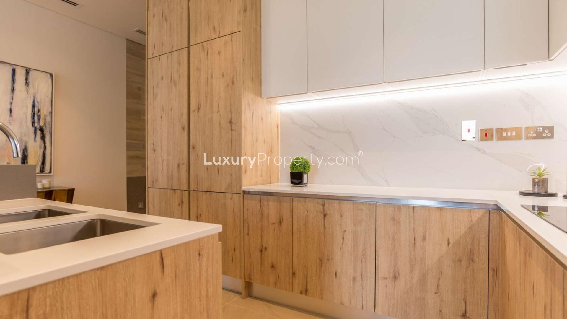 Luxurious living room in Al Barari duplex apartment, modern decor, spacious layout, natural light