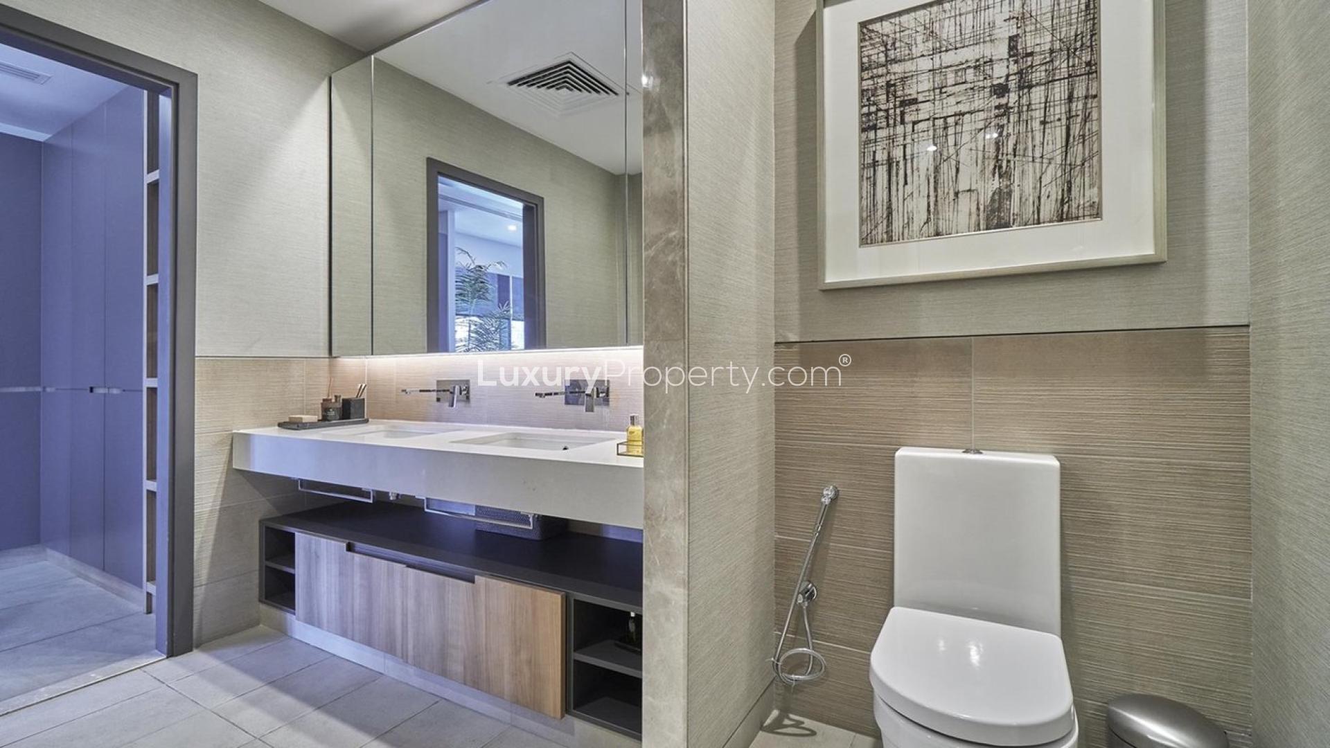 Modern bathroom in high-floor Downtown Dubai apartment, featuring sleek fixtures and elegant design