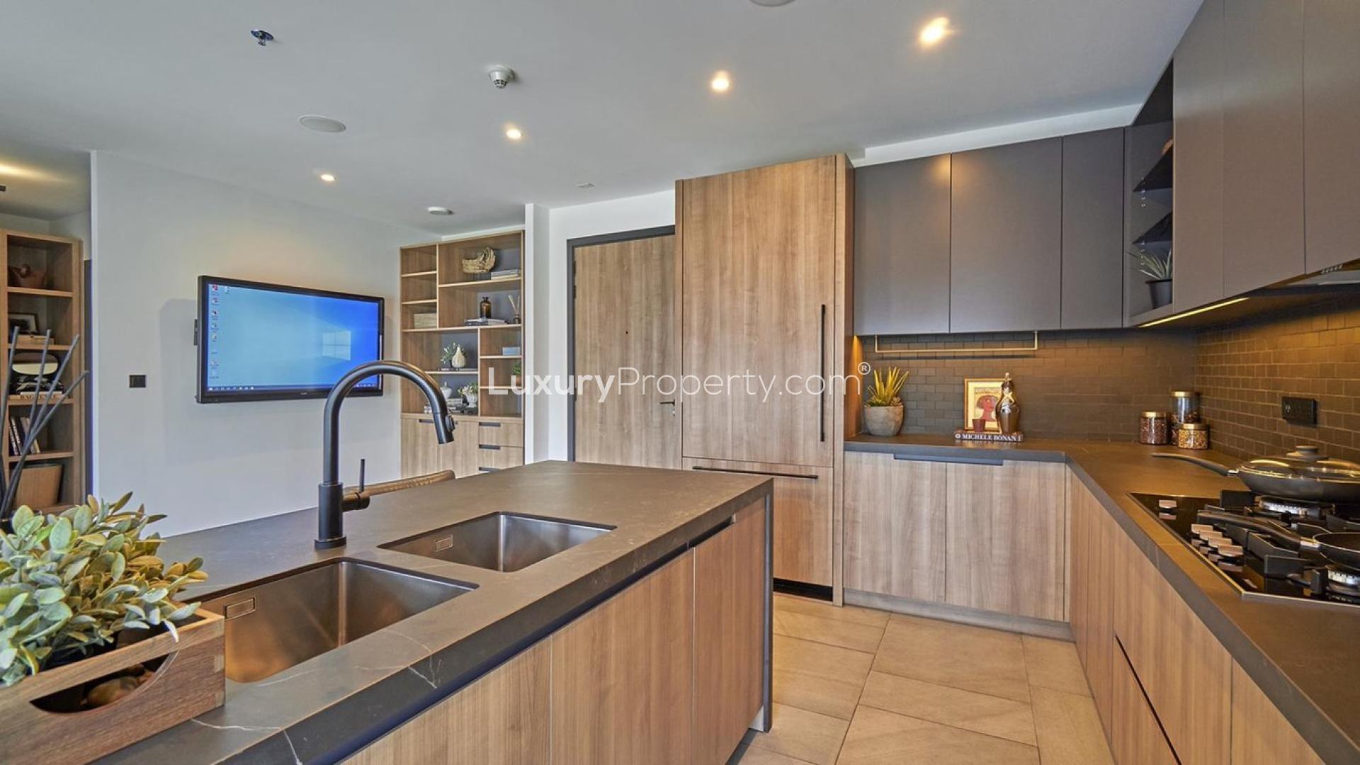 High-floor DT1 apartment kitchen with city view in Downtown Dubai, for sale