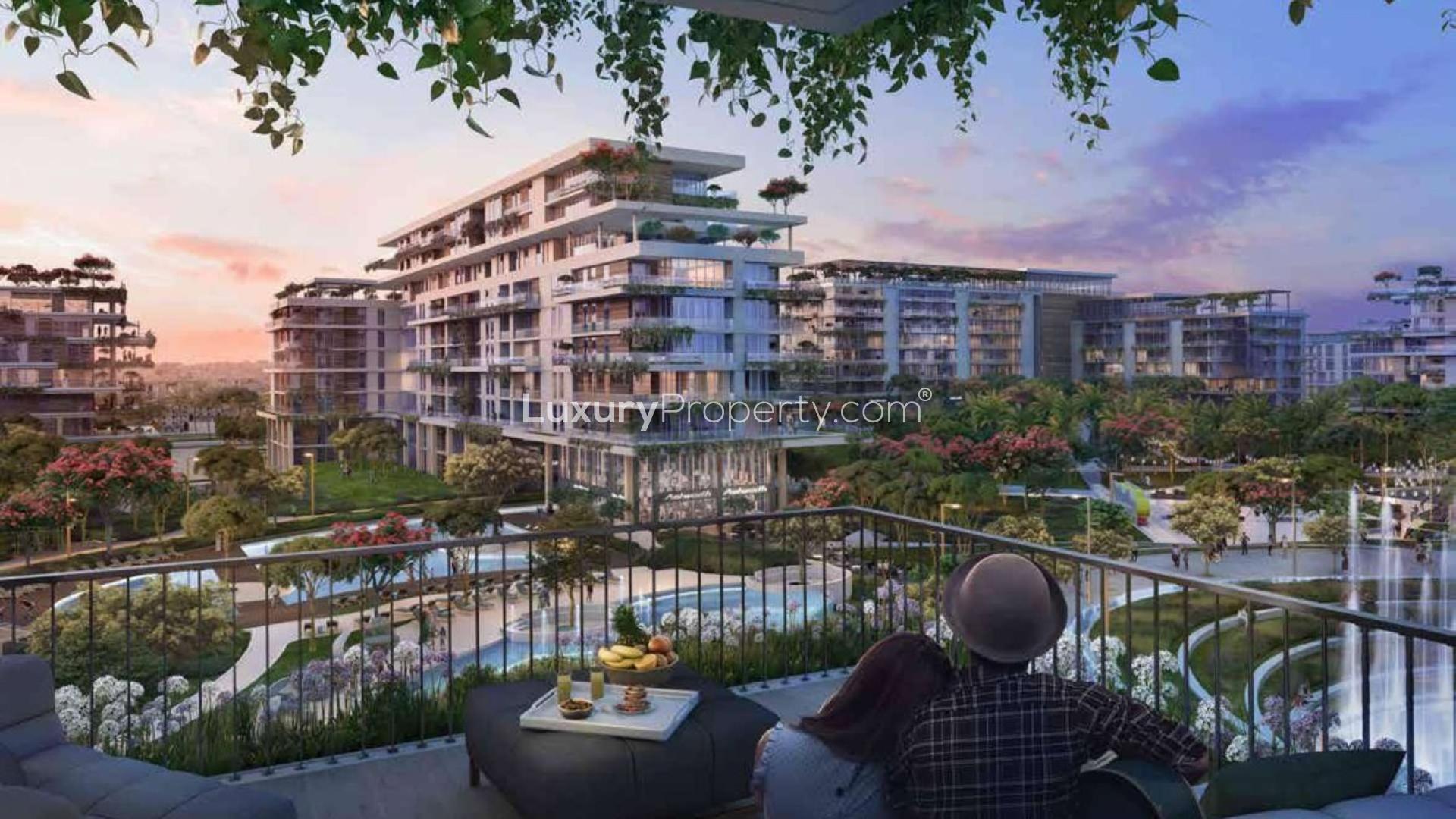 Contemporary low-floor apartment with park view, spacious balcony, and lush greenery at sunset