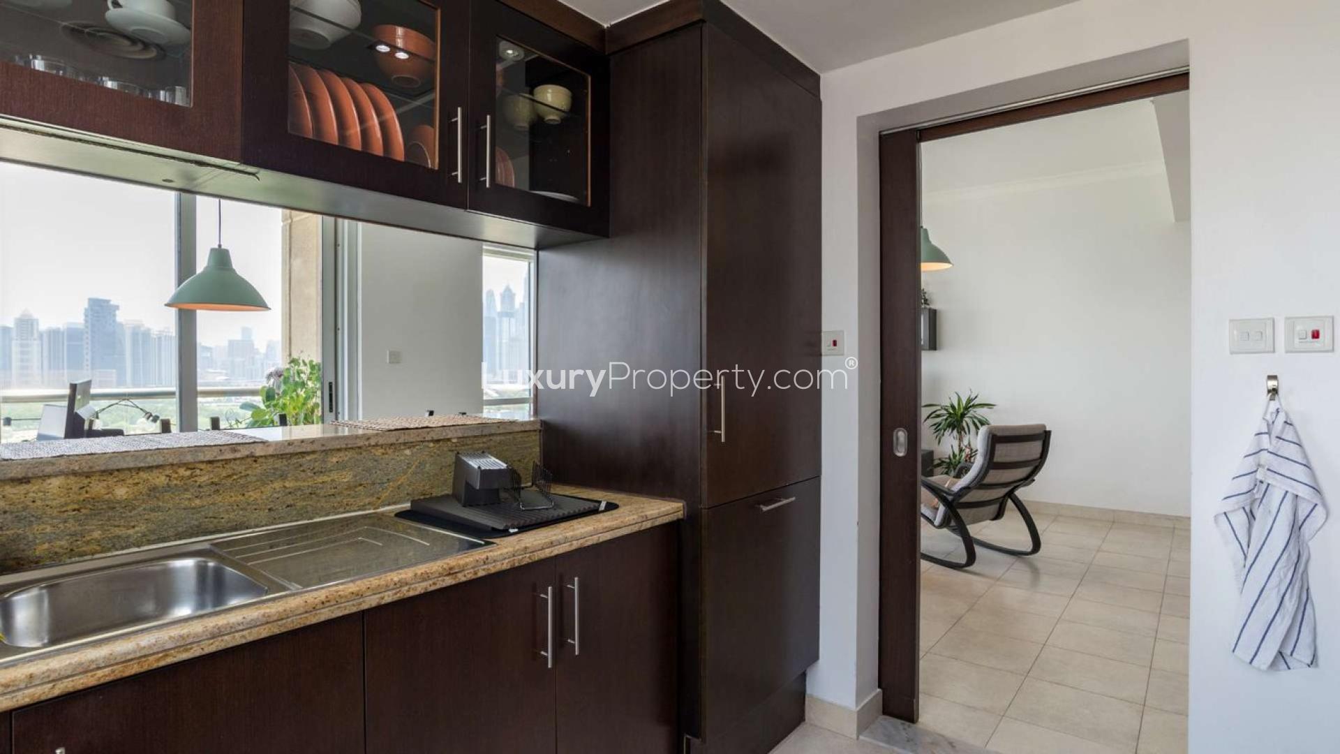 Aerial view of The Fairways, The Views community, with lush golf course and city skyline