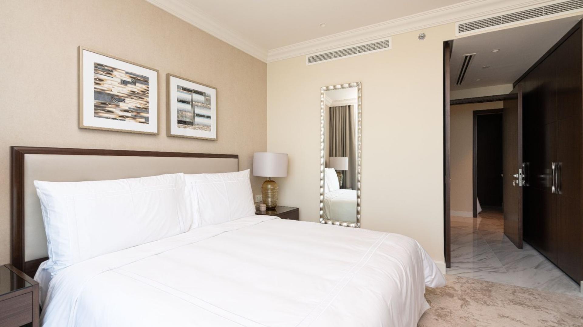 High-floor Downtown Dubai apartment living room with stunning city views and elegant decor