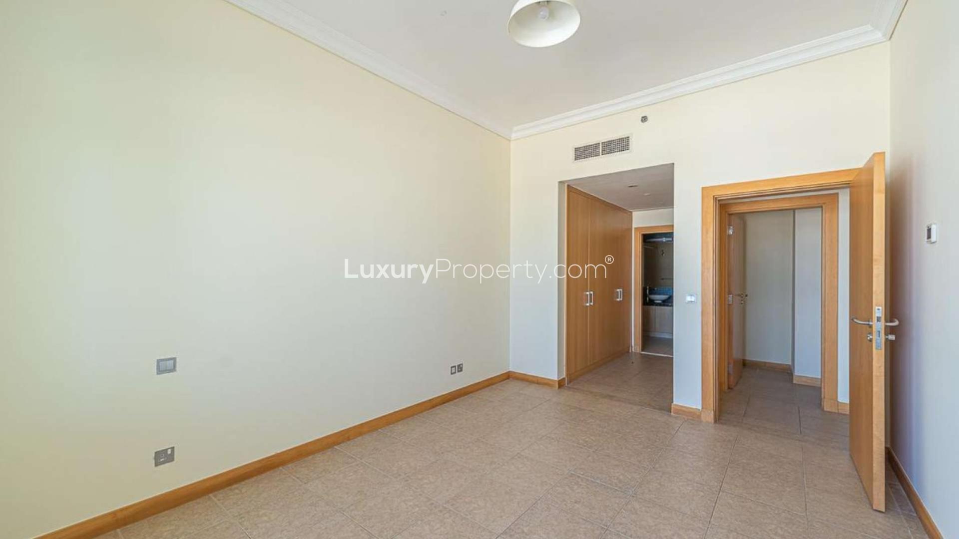 Palm Jumeirah apartment balcony view, overlooking beach and skyline, Burj Al Arab visible