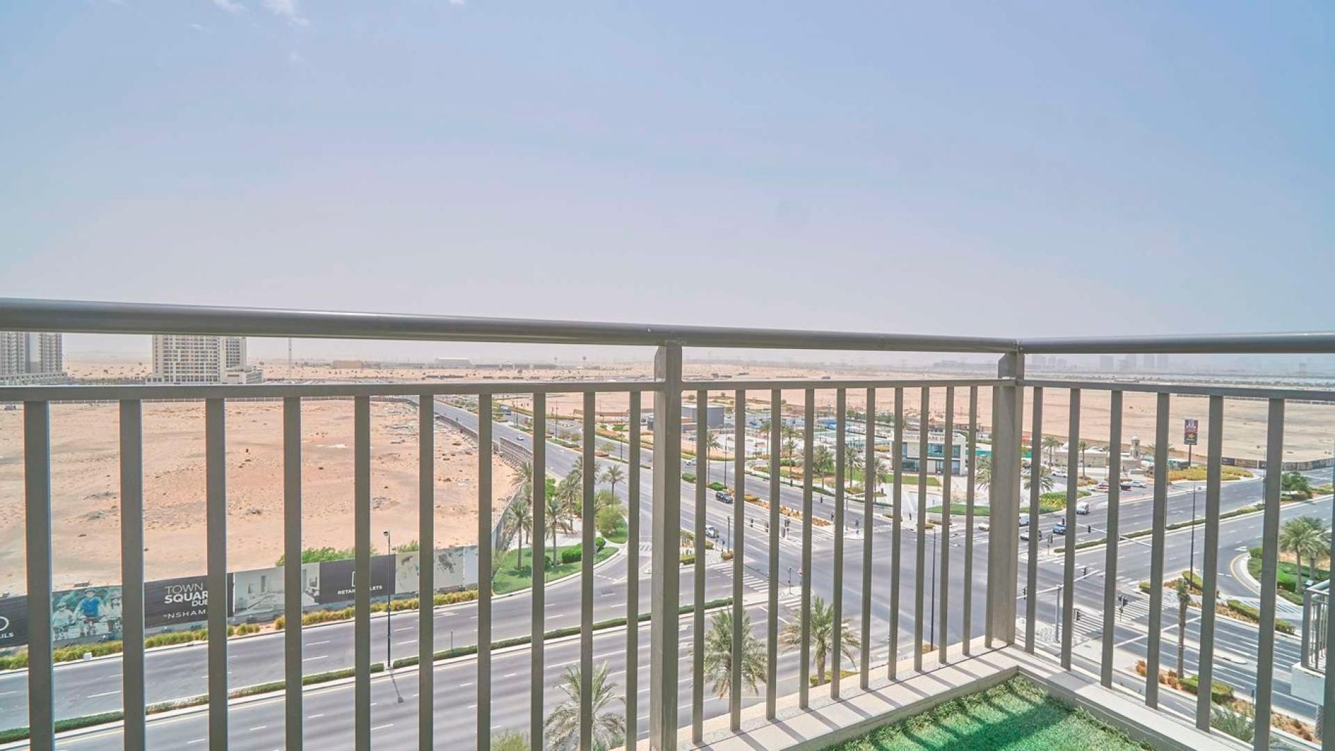 Living room in Zahra, Town Square apartment with cozy seating and balcony view