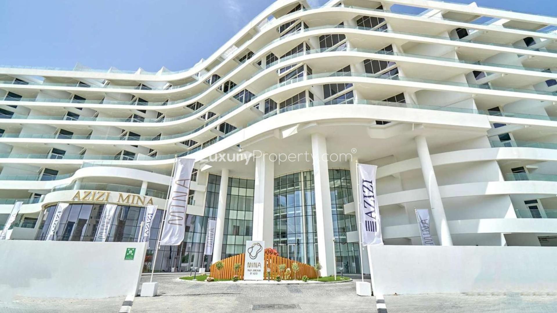 Modern Azizi Mina apartment building facade in Palm Jumeirah, Dubai, for sale