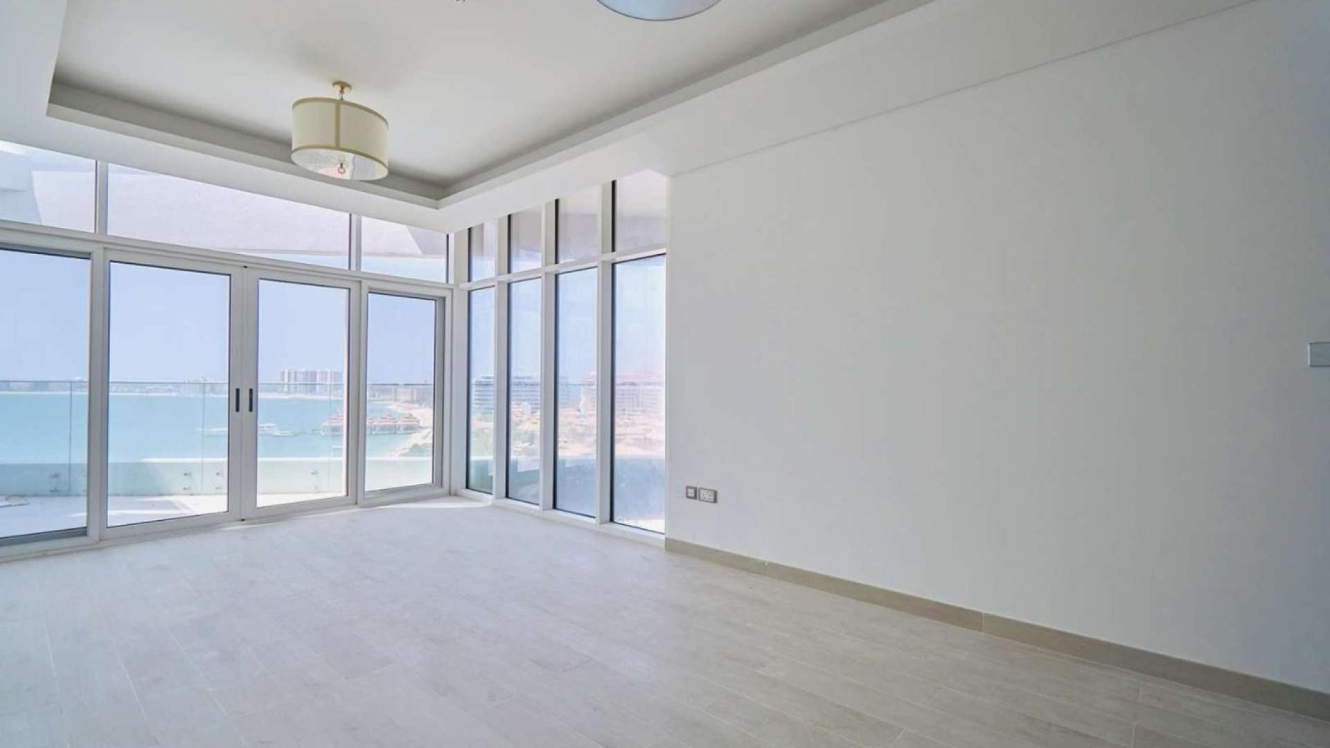 Empty apartment with large windows, sea view, and private beach access in Palm Jumeirah