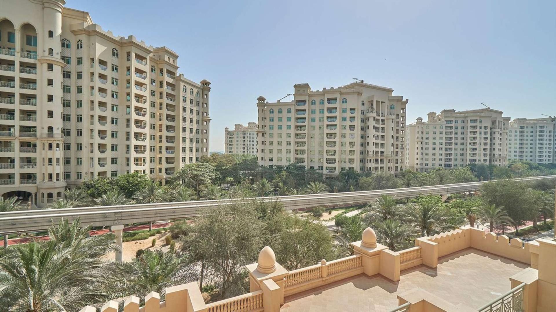 Stylish living room in Palm Jumeirah apartment, bright decor, large window view