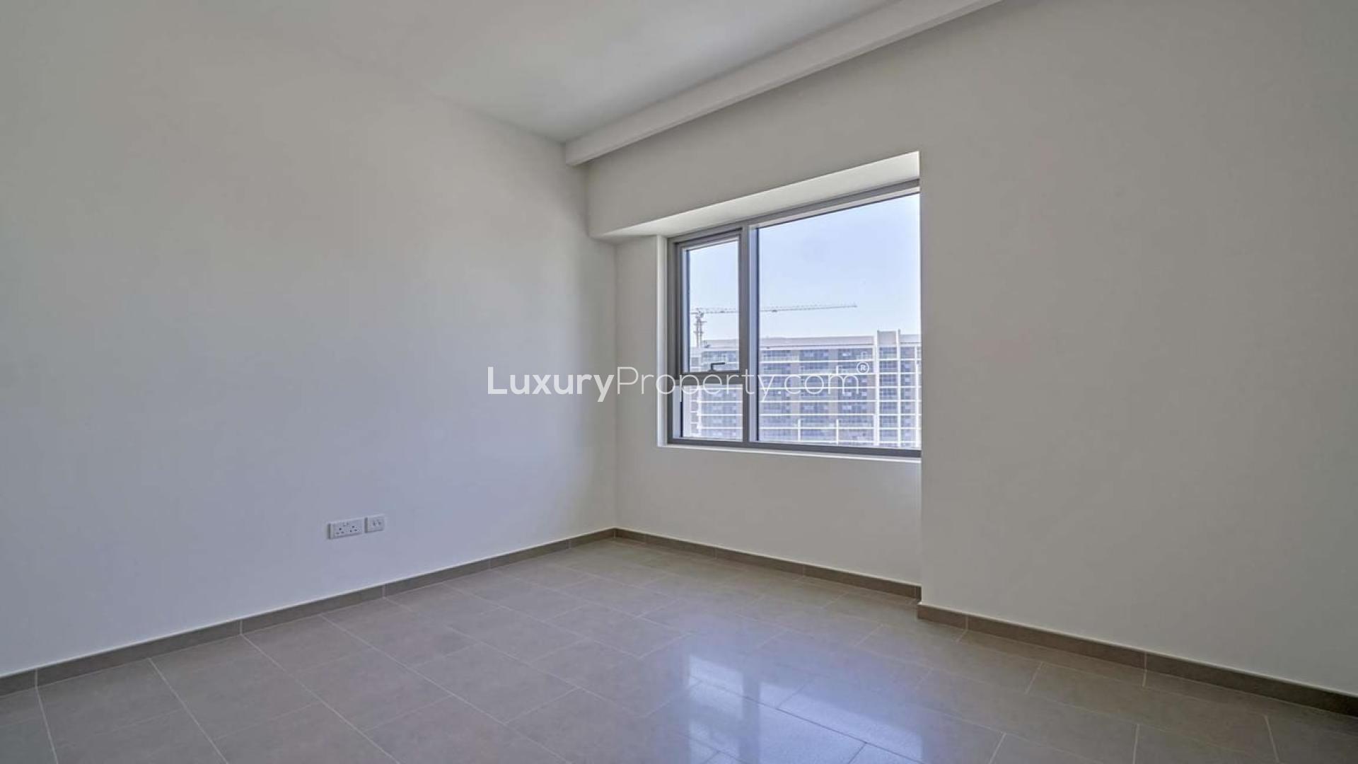 Modern apartment interior with balcony view in Dubai Hills Estate, Park Heights