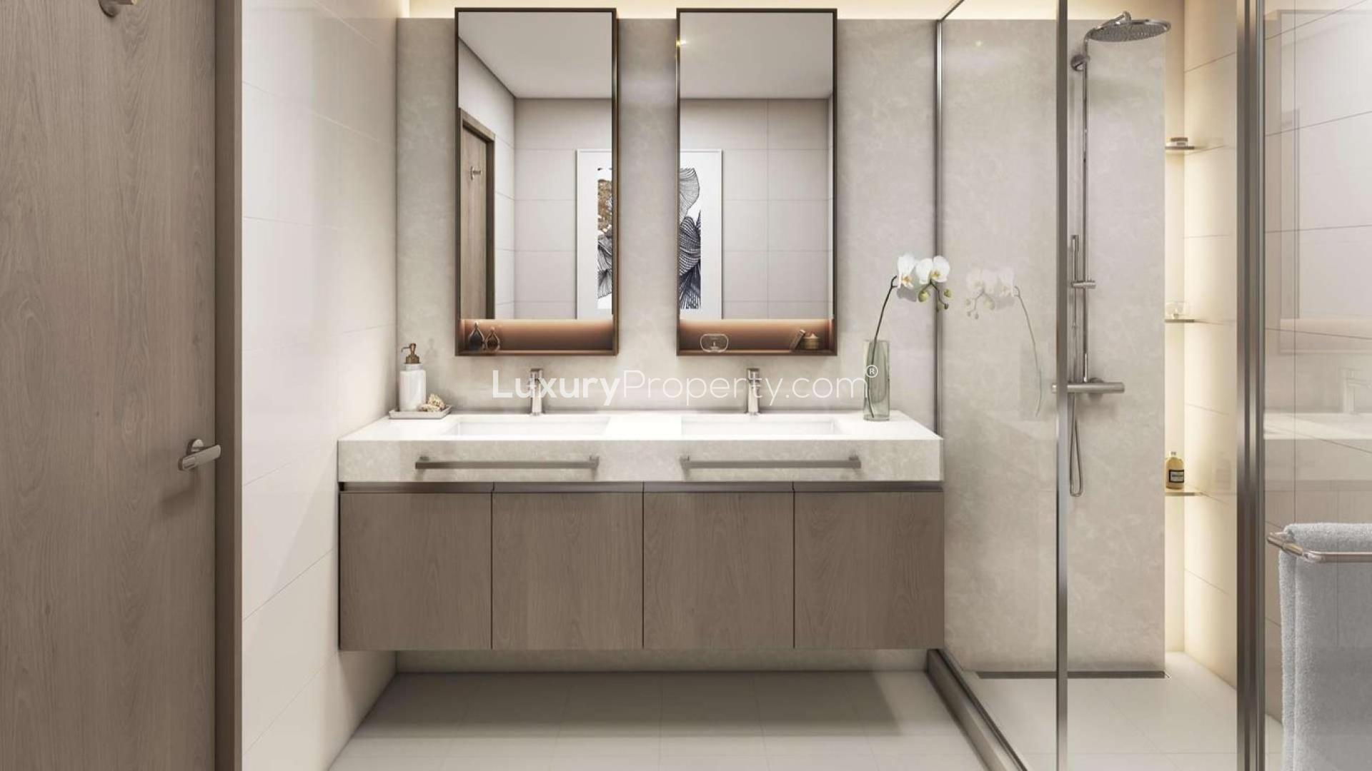 N/A,Modern bathroom in Elie Saab apartment, featuring dual sinks and glass shower in Dubai Harbour