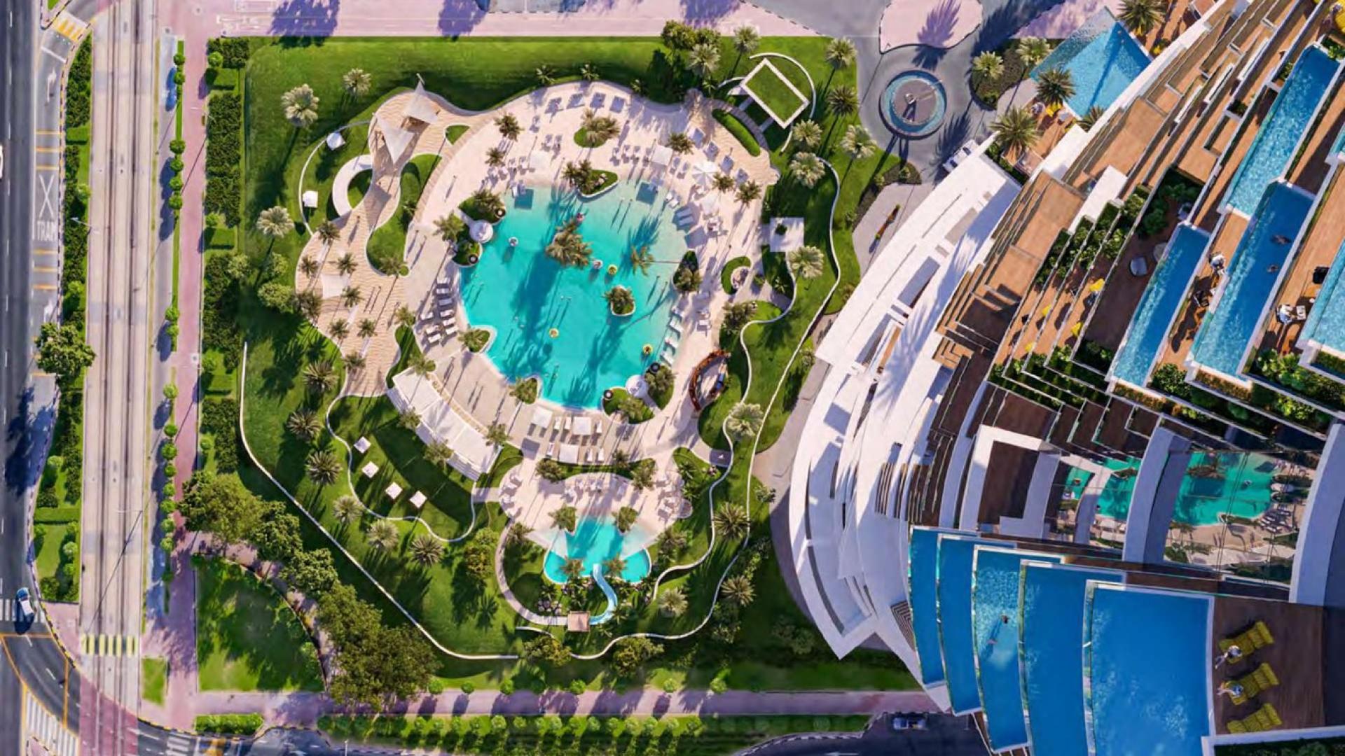 Cavalli-designed waterfront apartment building in Dubai Marina skyline at sunset, for sale