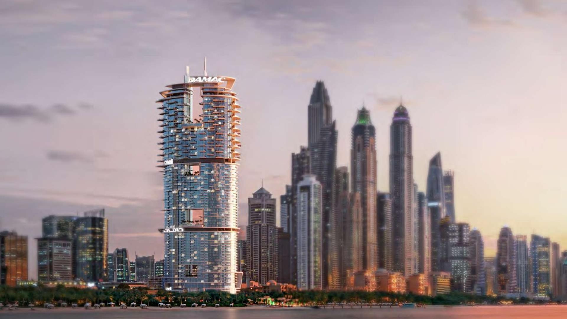 Stylish Cavalli-designed apartment building in Dubai Marina skyline at sunset