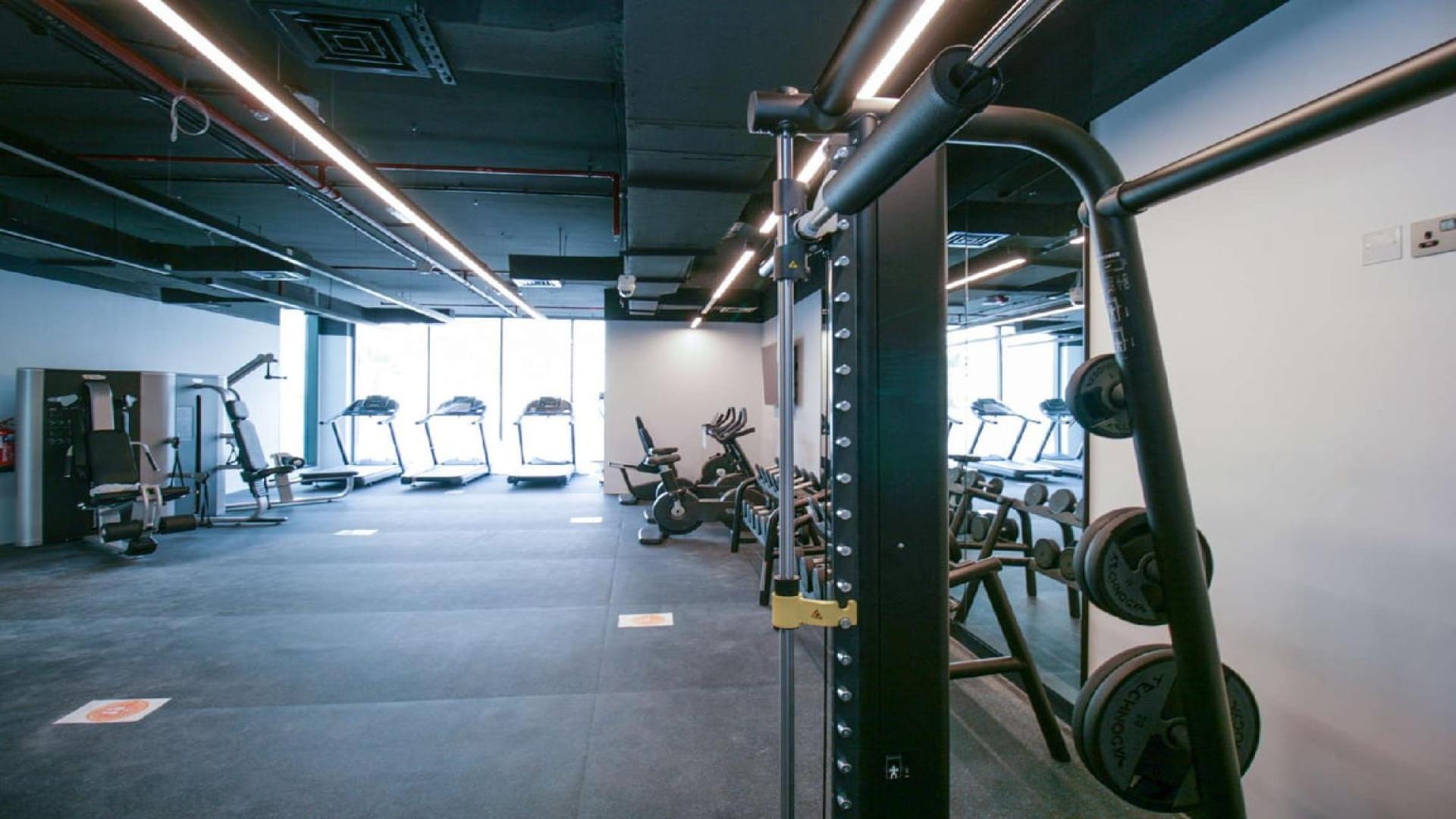 Modern living and dining area in Dubai Marina apartment, LIV Residence, with marina views