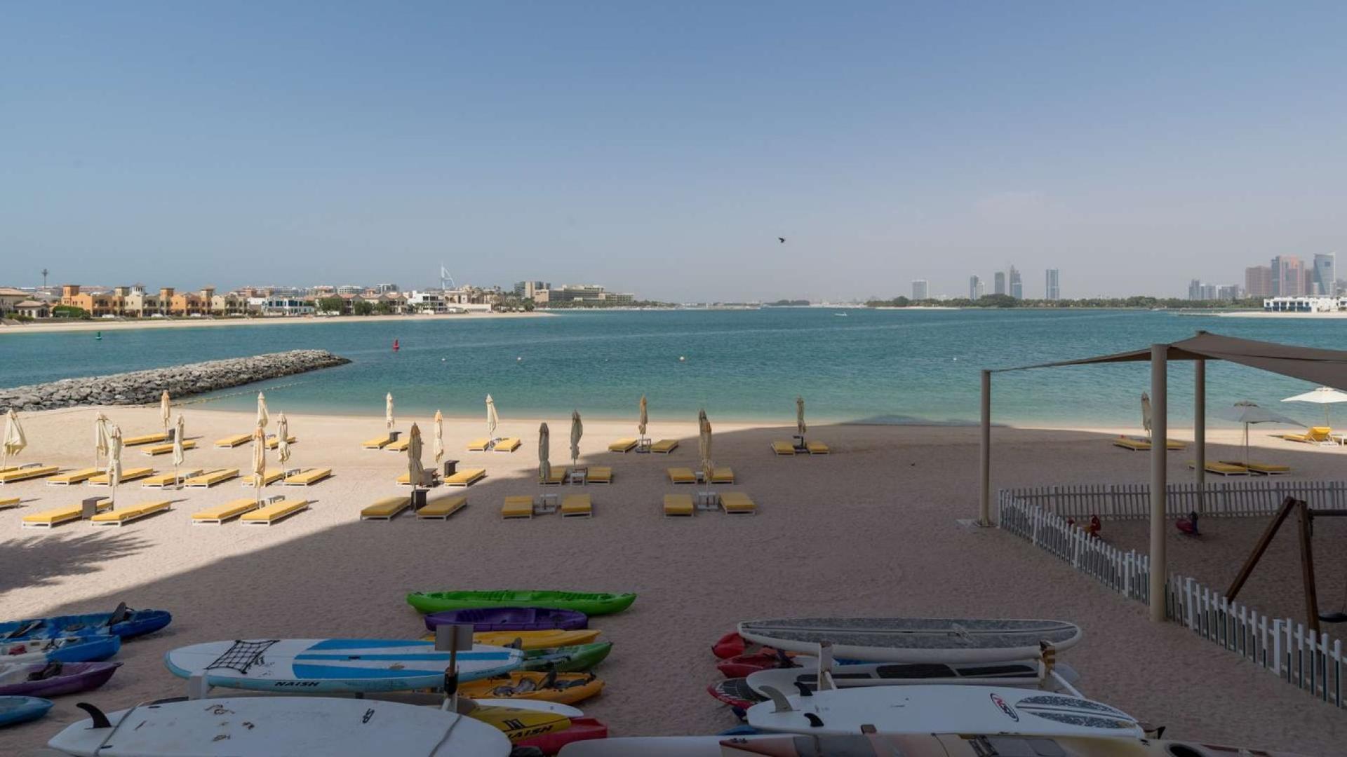 Luxury beachfront apartment living room with marina view in Tiara Residences, Palm Jumeirah