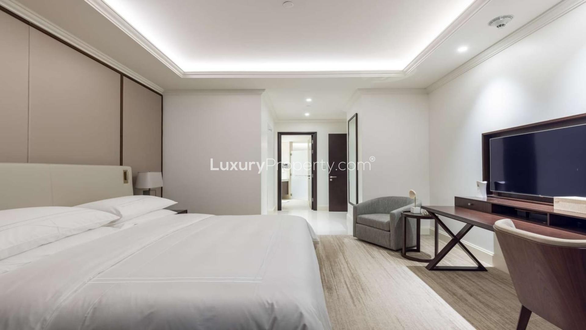 Luxurious living room in Downtown Dubai apartment, modern furnishings, spacious layout, elegant design