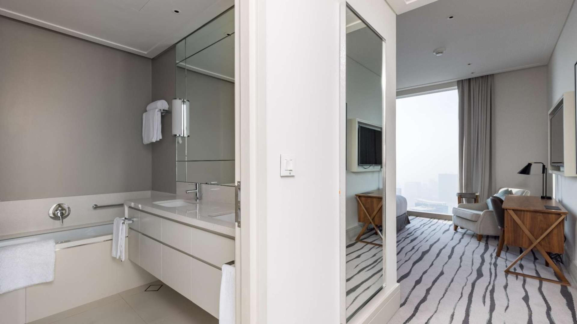 Modern living room in Vida Residences apartment, Downtown Dubai, with city views