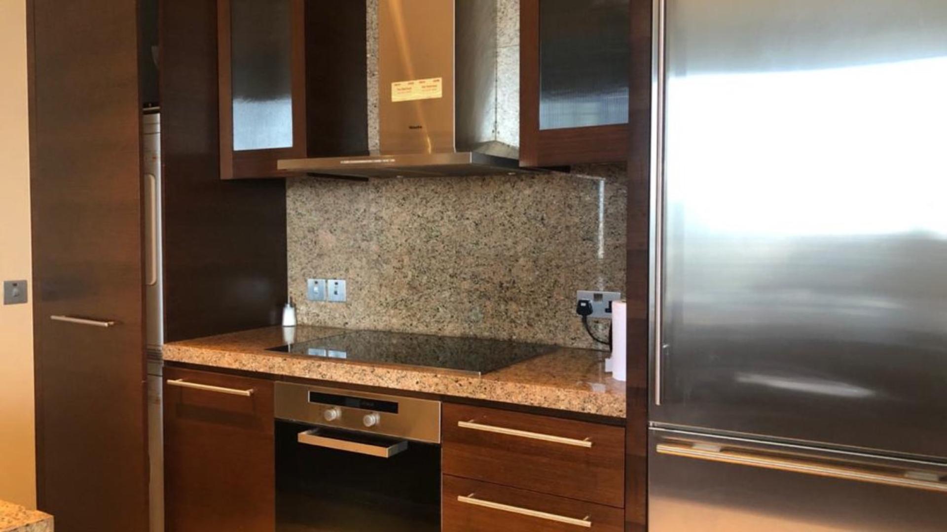 Mid-floor two-bedroom apartment living room in Burj Khalifa, Downtown Dubai