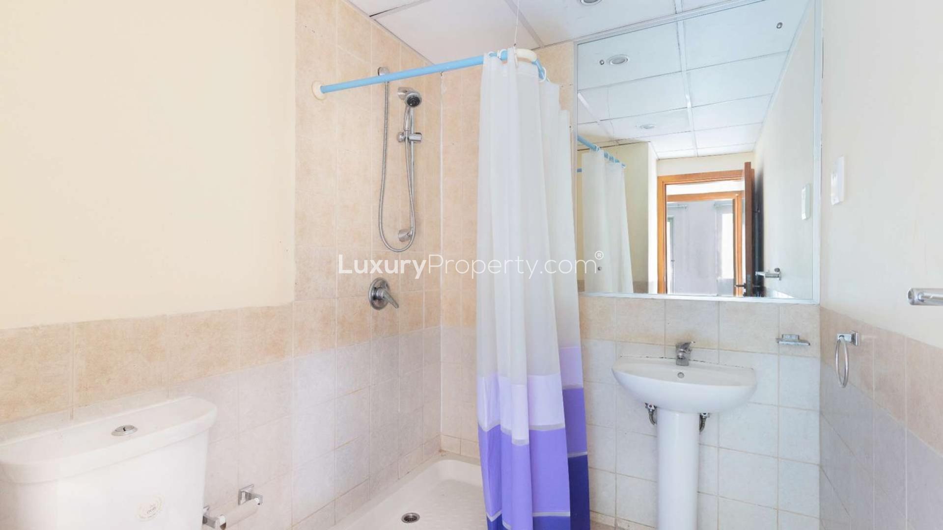 Sunny balcony view, Al Alka 3 apartment, The Greens, lush greenery, modern outdoor seating