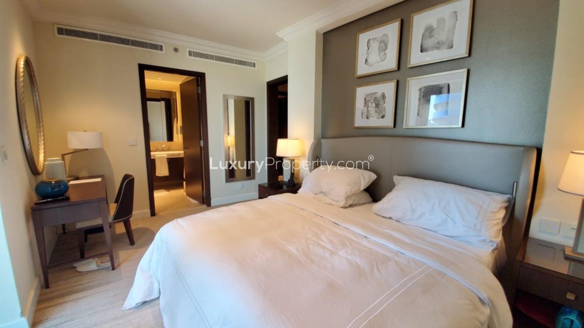 Balcony view from spacious Downtown Dubai apartment, showcasing skyline and Burj Khalifa