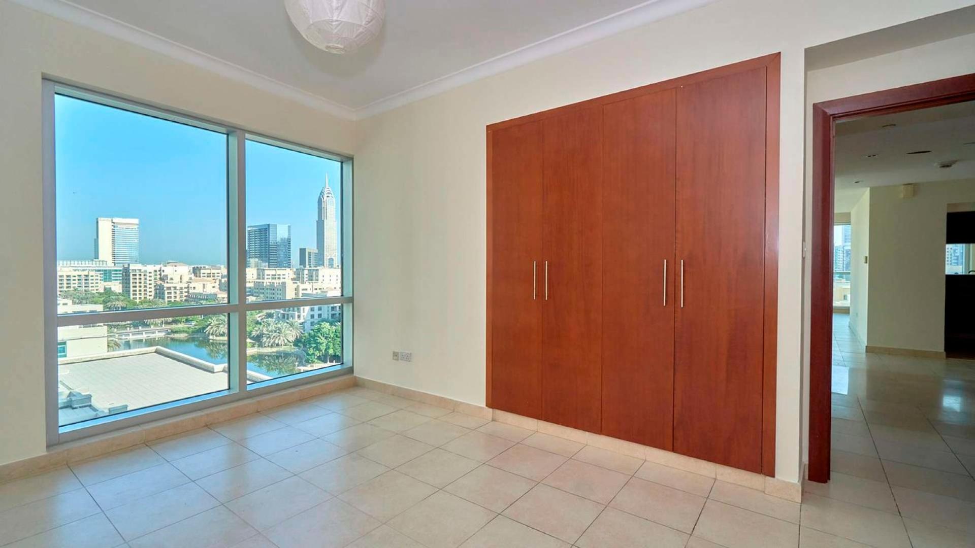 Aerial view of The Fairways, The Views, with lake and golf course scenery