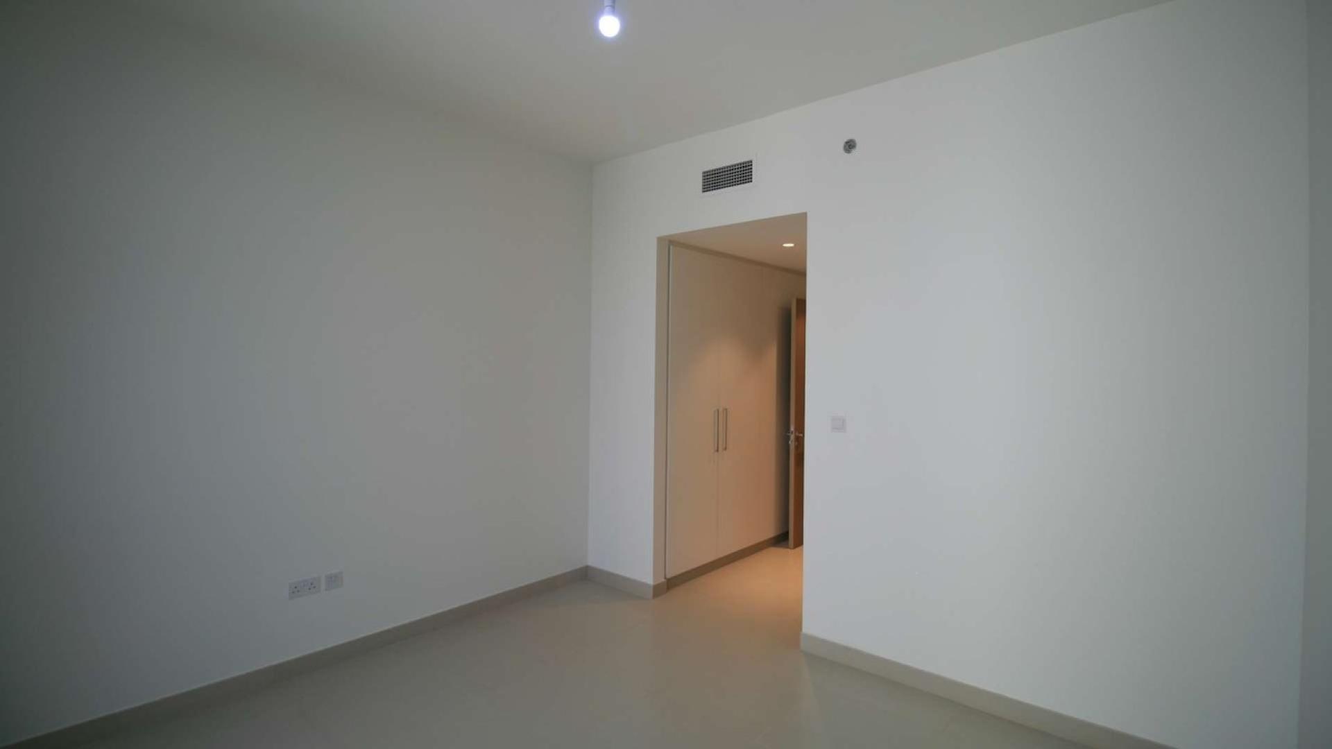 Modern apartments in Dubai Hills Estate overlooking landscaped park and recreational area