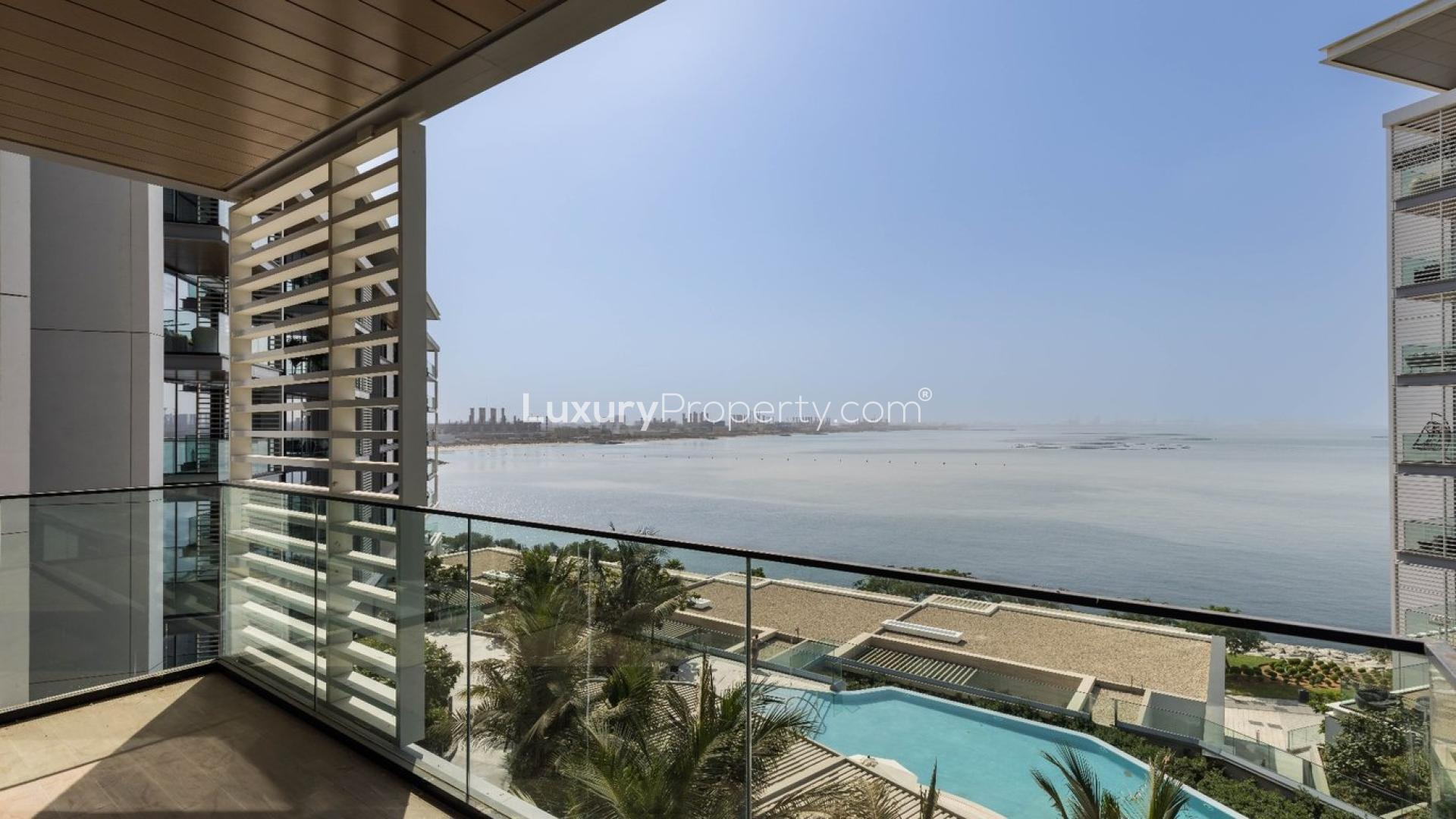 Balcony view from Bluewaters apartment for sale, overlooking pool and sea