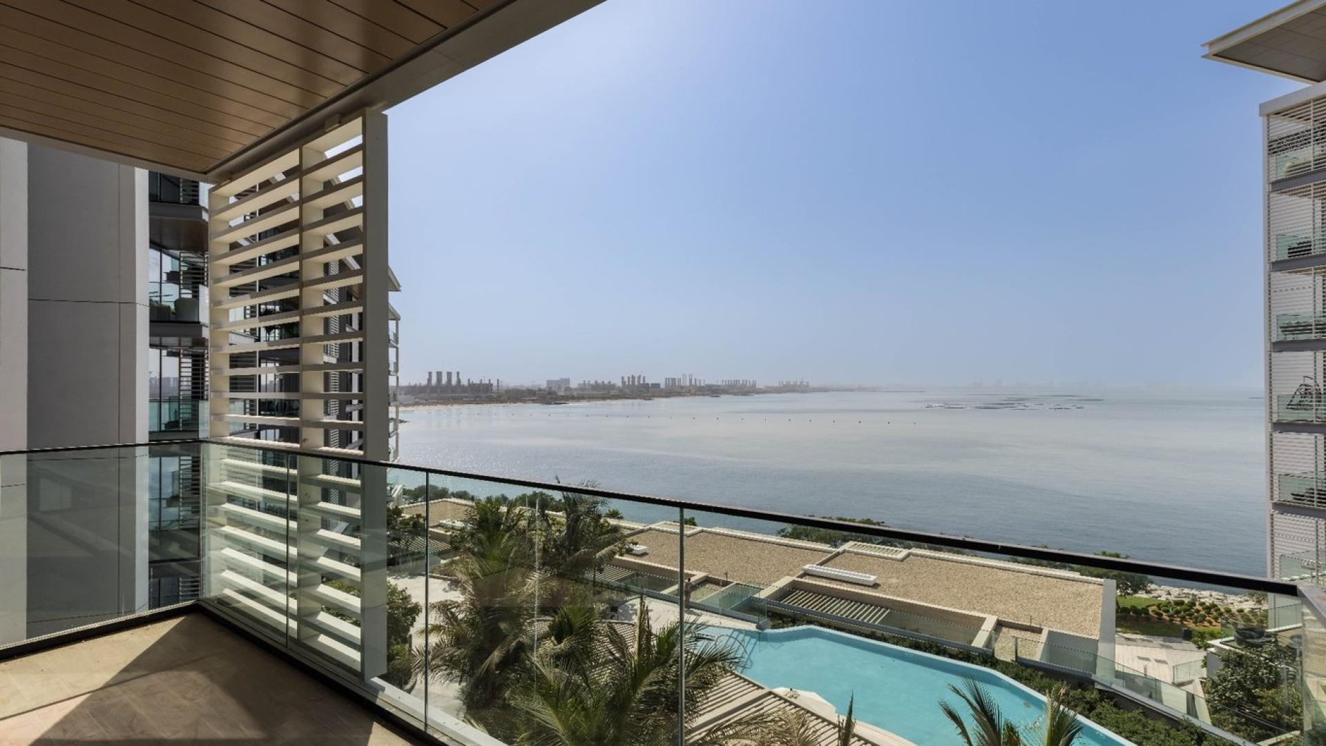 Balcony view from Bluewaters apartment for sale, overlooking pool and sea