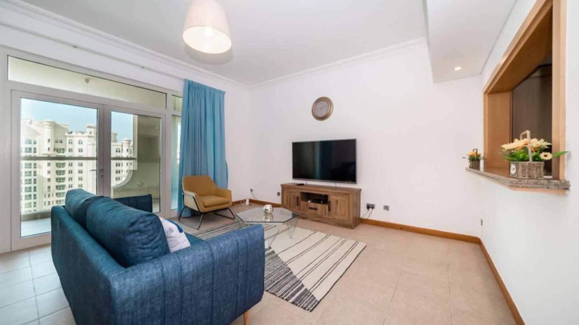 Modern kitchen with granite countertops in Shoreline Apartment, Palm Jumeirah, Dubai