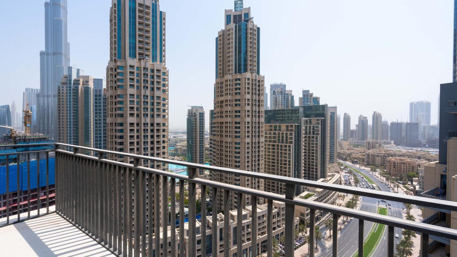 High floor balcony view of Downtown Dubai skyline from BLVD Crescent apartment