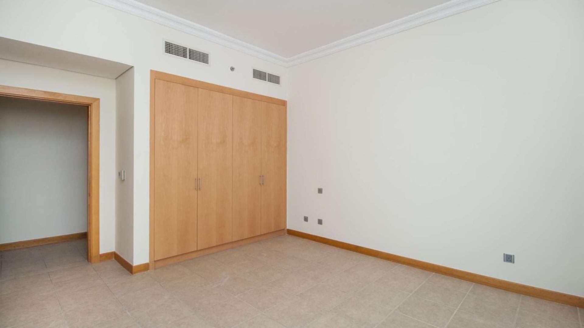 View of Shoreline Apartments on Palm Jumeirah, showcasing lush greenery and modern architecture