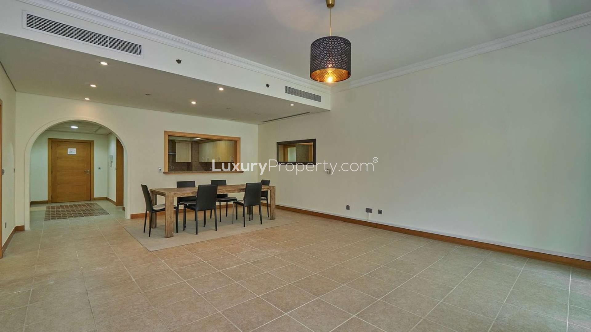 Dining area in beachfront apartment, Palm Jumeirah Shoreline, featuring modern decor and natural light