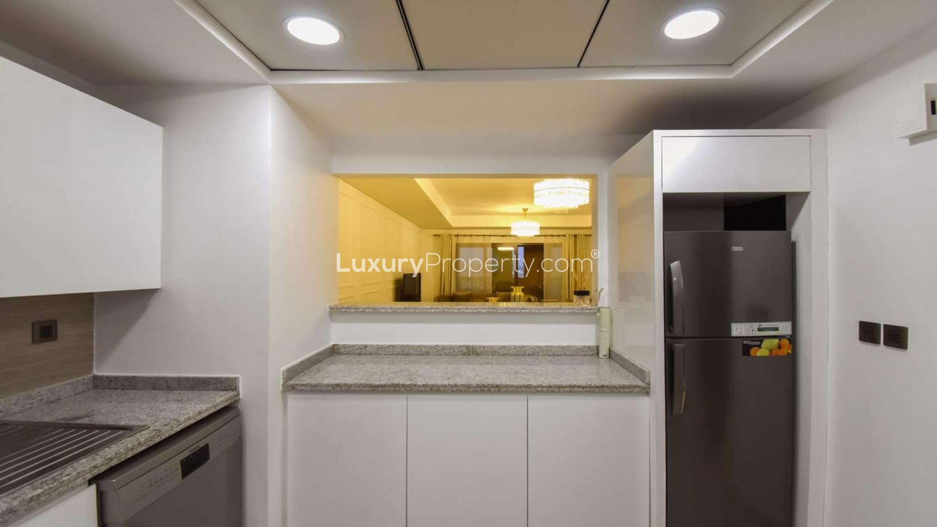 Luxurious living room in high-floor Palm Jumeirah apartment, elegant decor, spacious seating area