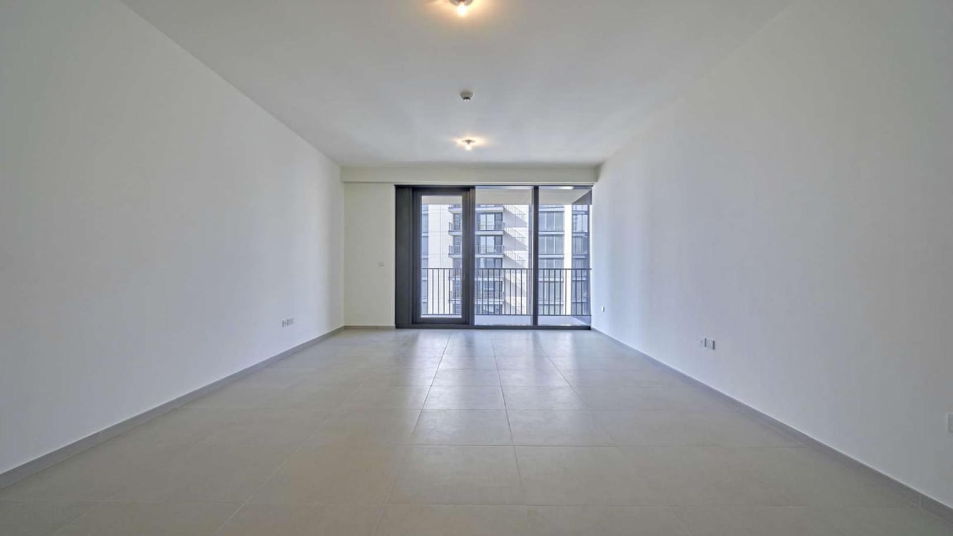 Contemporary living room in BLVD Heights apartment, Downtown Dubai, with large windows
