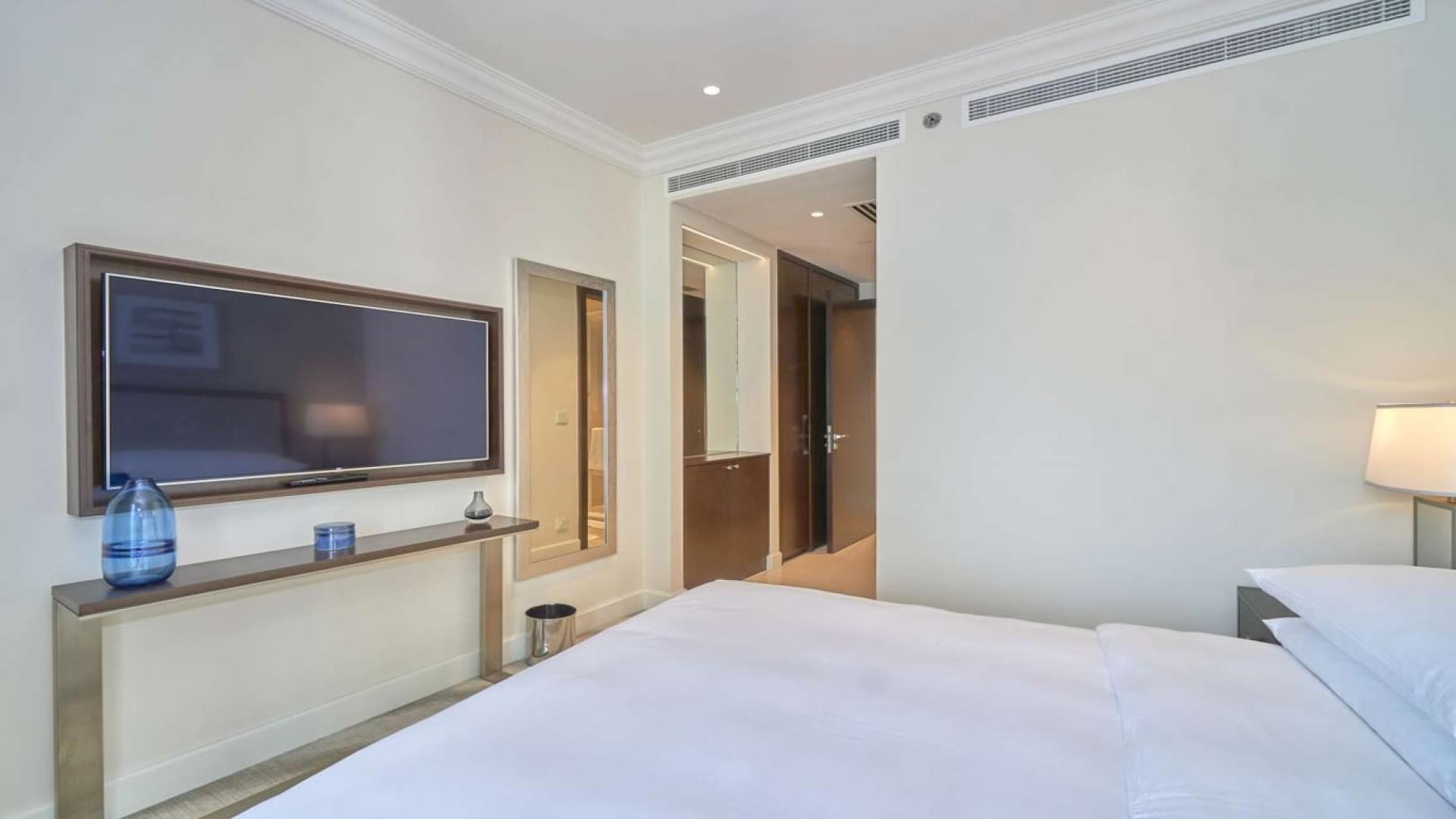 High floor apartment living room with Burj Khalifa and Fountain view in Downtown Dubai