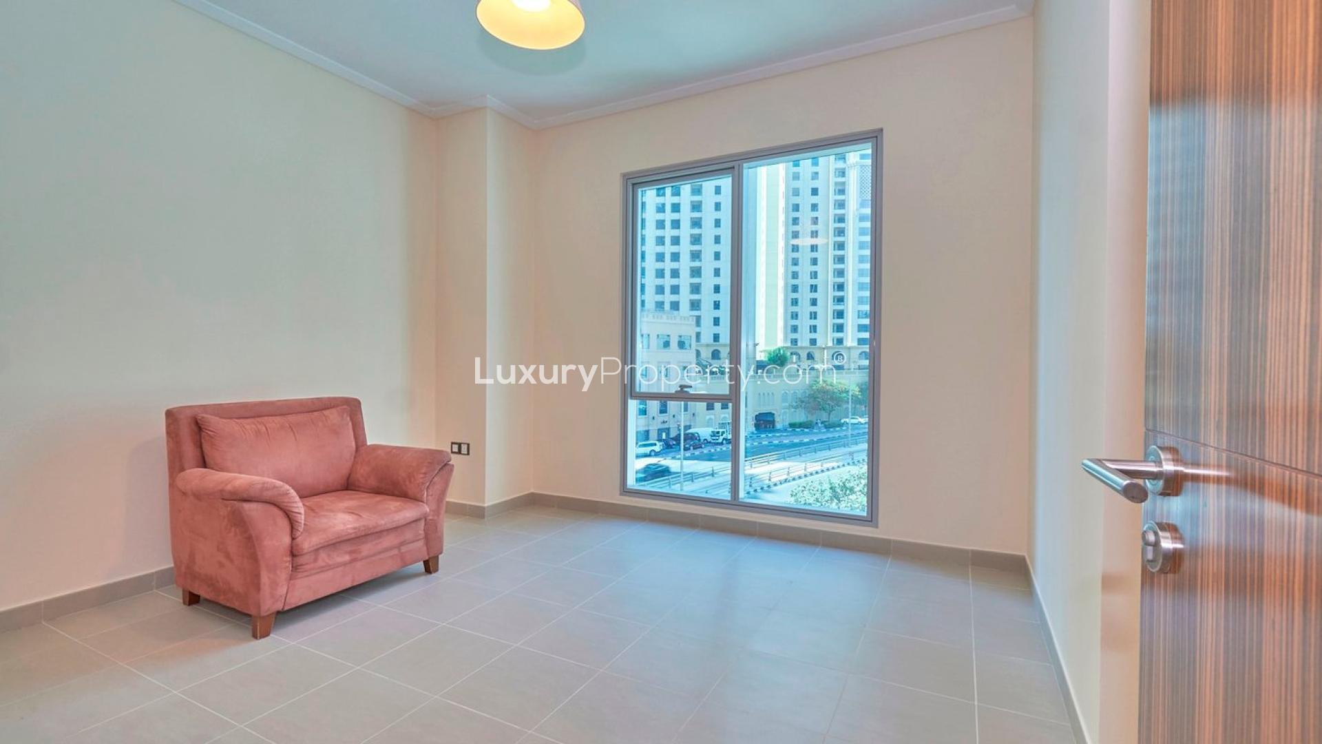 Spacious living room with large windows in Dubai Marina apartment for sale, Marina Promenade