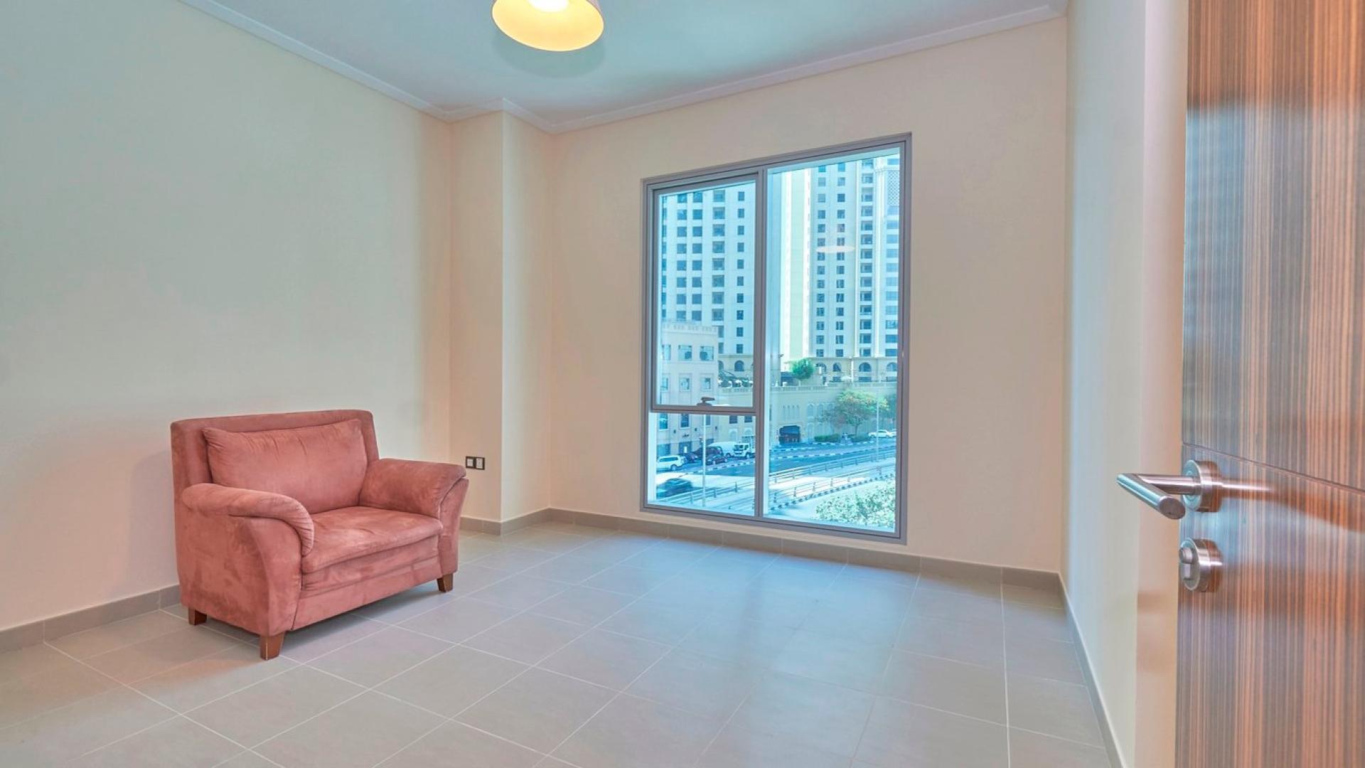 Spacious living room with large windows in Dubai Marina apartment for sale, Marina Promenade