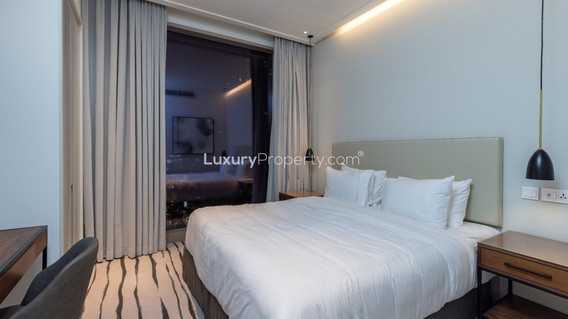 Luxurious Vida Residence apartment balcony view of Downtown Dubai and Burj Khalifa at dusk