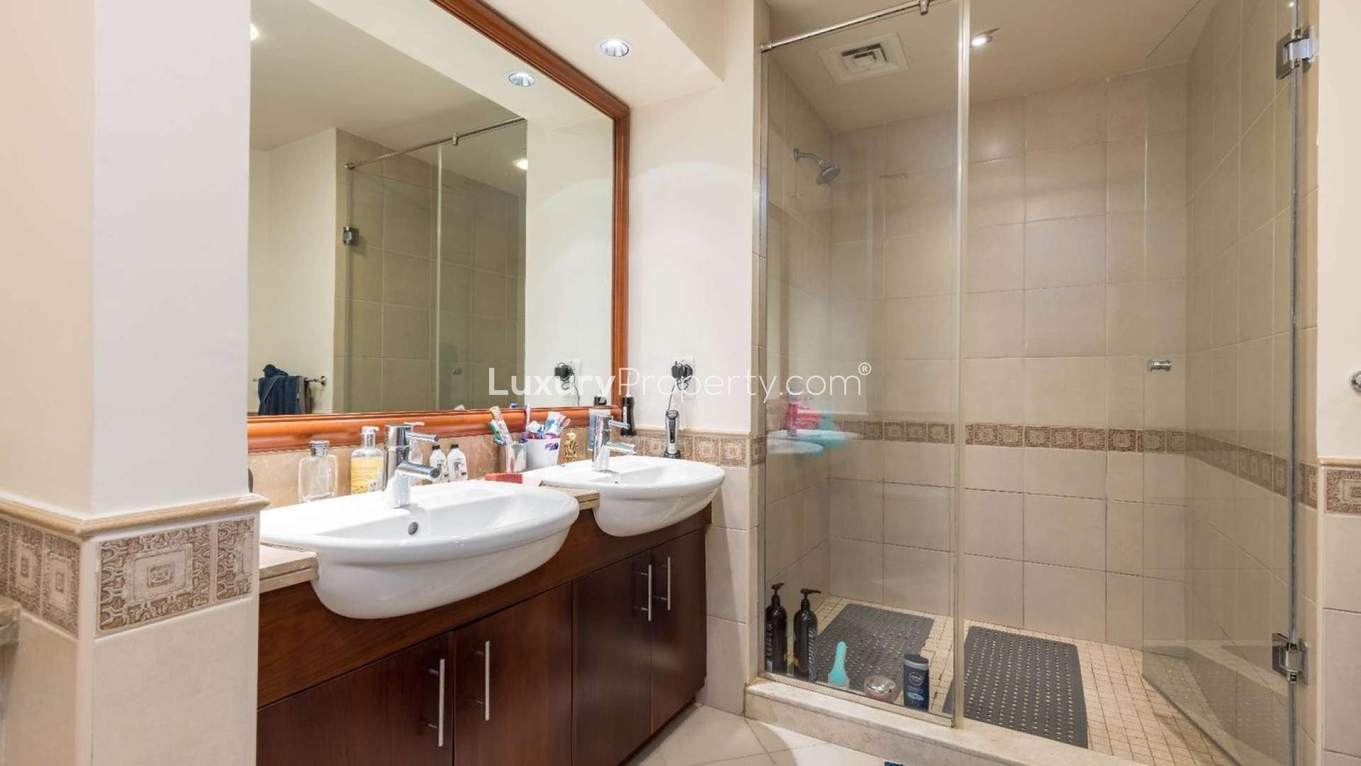 Modern kitchen with wooden cabinets in Palm Jumeirah apartment near Nakheel Mall, Golden Mile