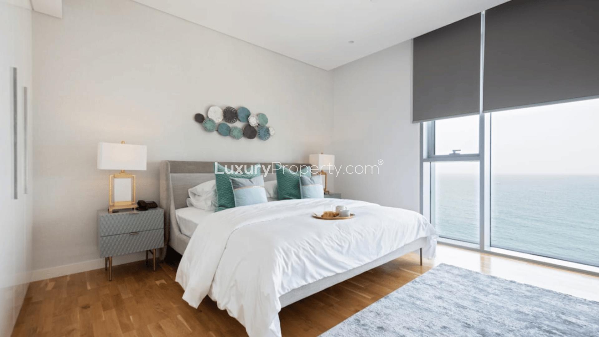 Stylish living room in Bluewaters two-bedroom apartment with modern decor and large TV