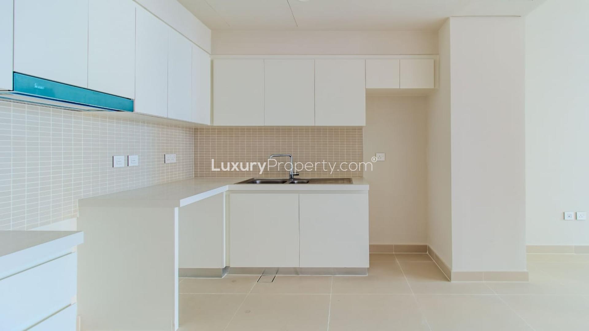 Brand new apartment interior at Harbour Gate, Dubai Creek Harbour, kitchen and living area