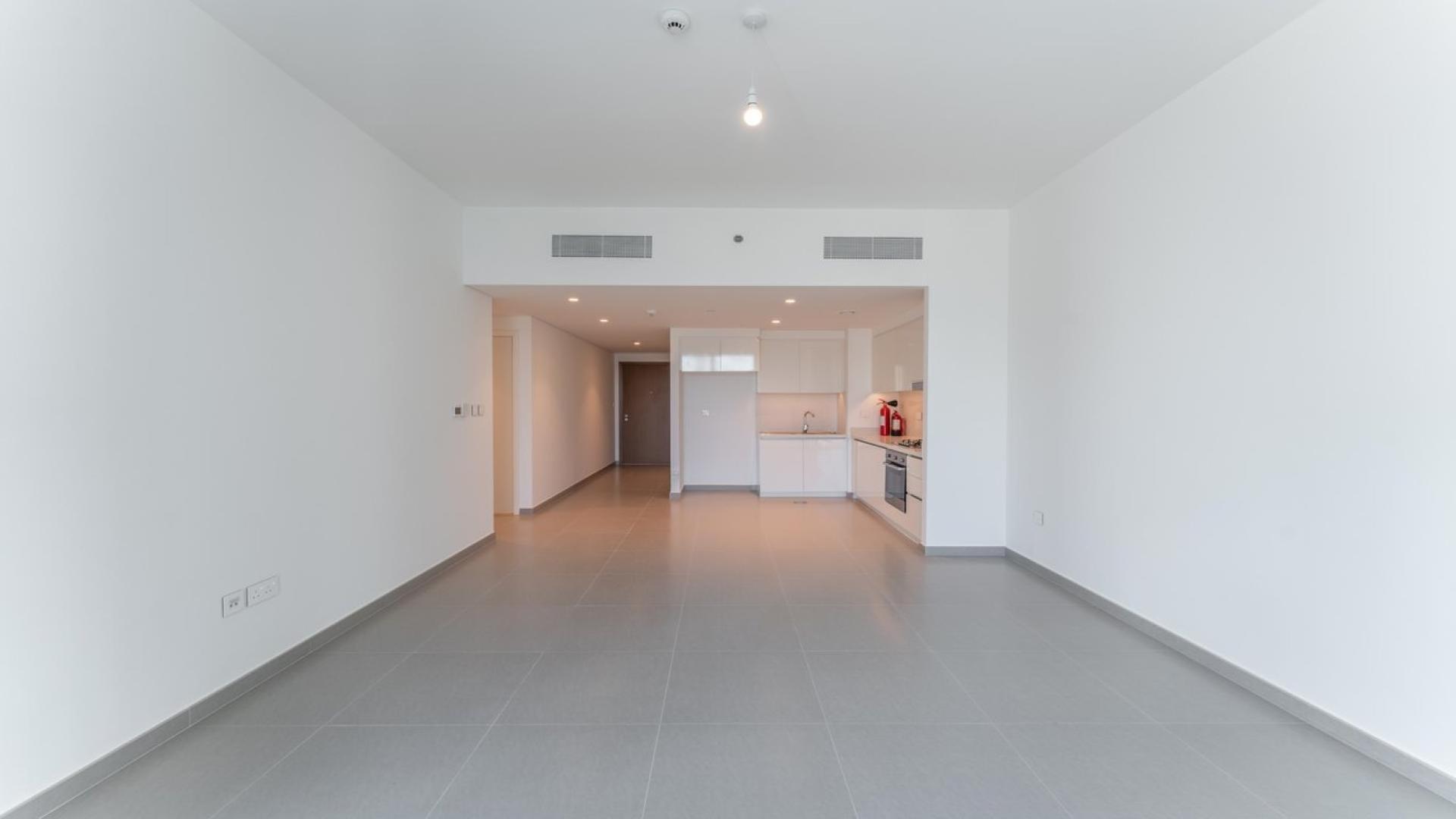 Bright empty room with large window, Downtown Dubai skyline view, Downtown Views II apartment