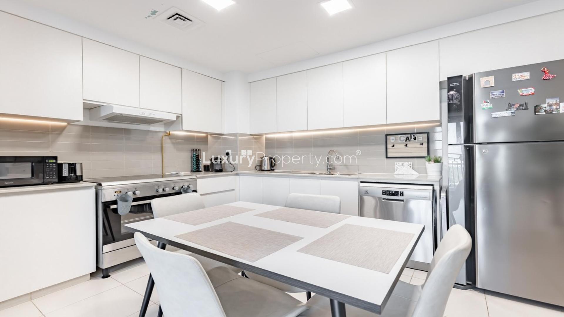 Modern kitchen in stylish 2-bedroom Zahra Breeze apartment, Town Square, for sale