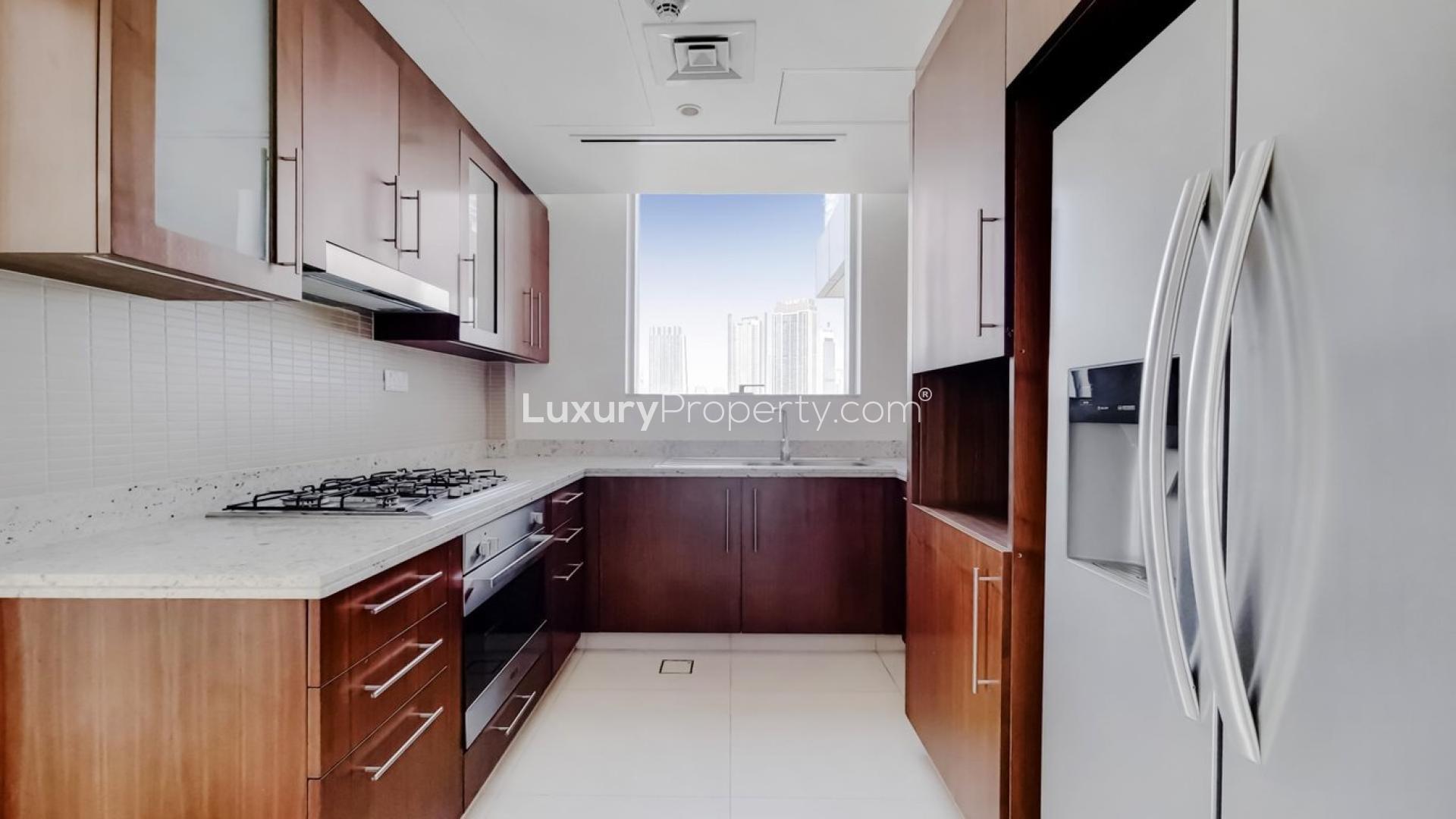 Bright living room in two-bedroom apartment, Boulevard Point, Downtown Dubai, with city skyline view