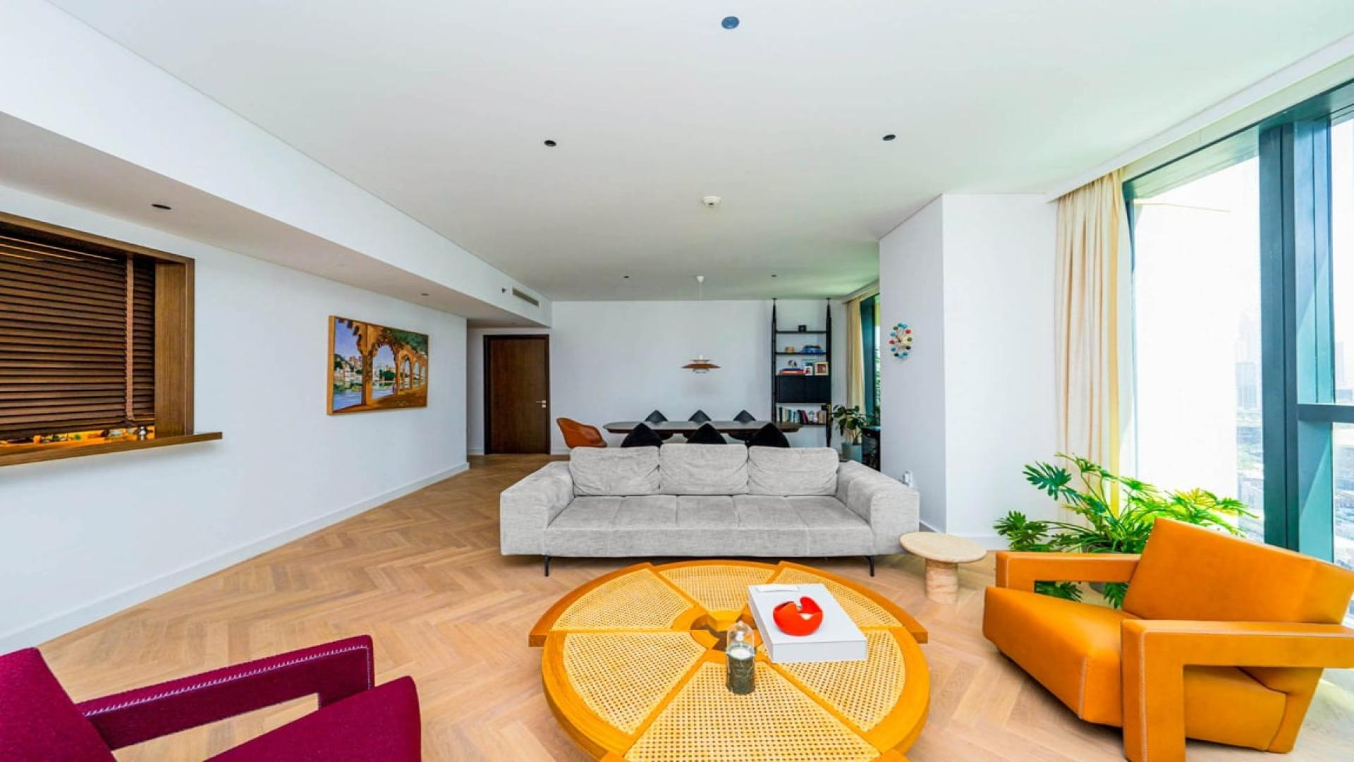 Modern living room in high-floor corner apartment, BLVD Heights, Downtown Dubai, bright city views