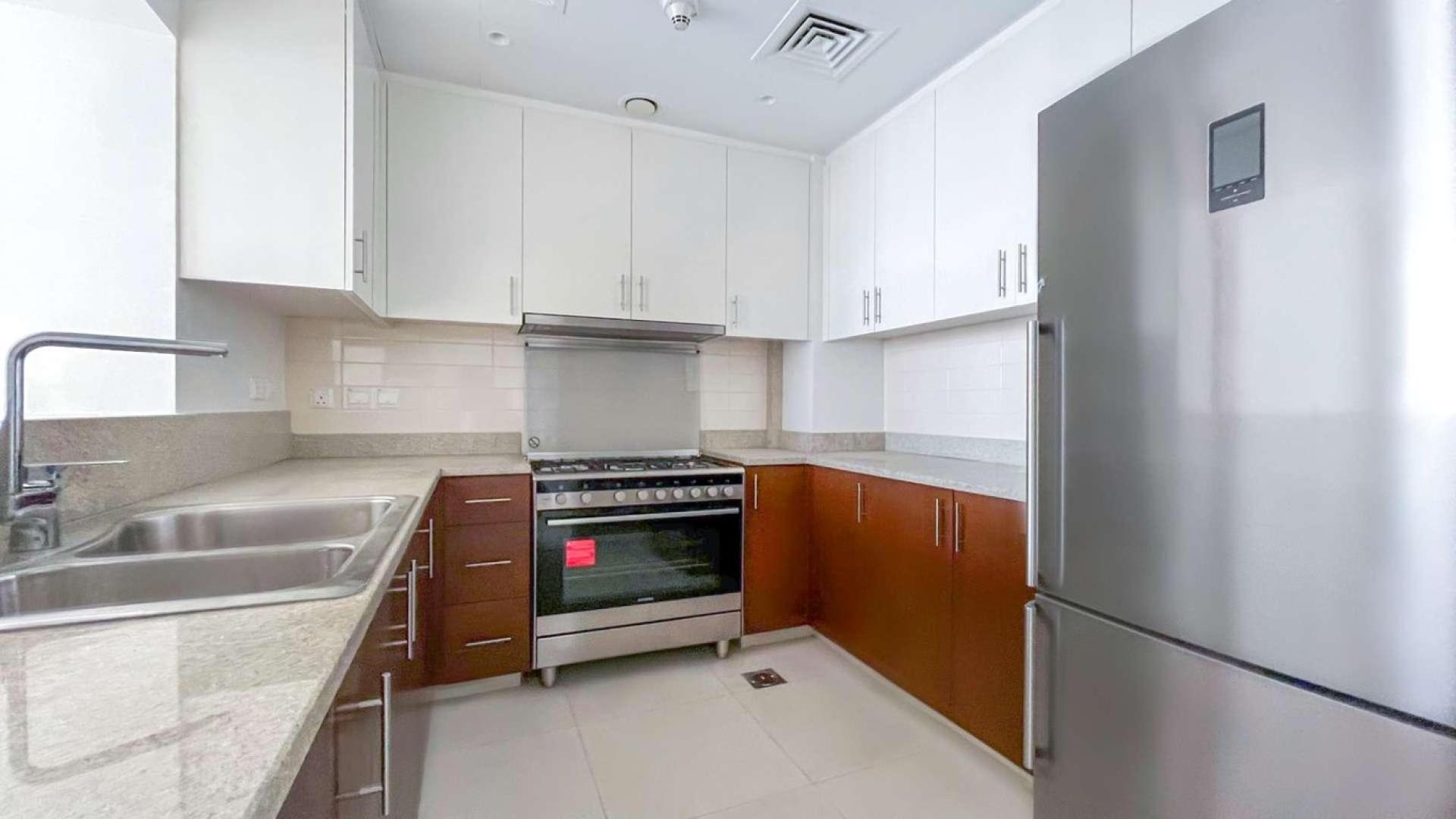 High-floor apartment interior with large windows in BLVD Crescent, Downtown Dubai, for sale